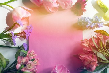 Flowers composition. Wreath made of pink flowers on pink background. Flat lay, top view, copy space. Spring floral background, texture, wallpaper. Spring flowers concept. Space for text