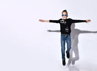 Fototapeta na wymiar Young boy jumping isolated over white background