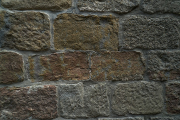 Natural stone wall texture. Medieval masonry. Ancient wall. Stone brick wall. Macro texture. Medieval architecture. Rough masonry. Background texture.