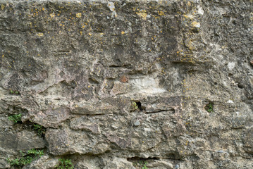 Natural stone wall texture. Medieval masonry. Ancient wall. Stone brick wall. Macro texture. Medieval architecture. Rough masonry. Background texture.