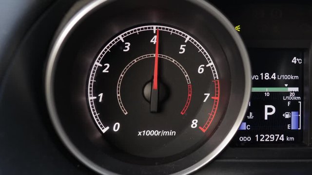RPM tachometer in a car dashboard raising and lowering
