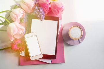Pretty Styled Desktop Mockup tablet, mockup smartphone, pink spring flowers on white background, great for lifestyle bloggers and small businesses. Blank screen, copy space. Home office.