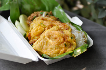 omelette, omelet and stir fried basil with pork