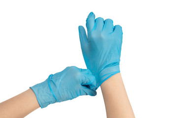 Woman puts on blue rubber gloves.