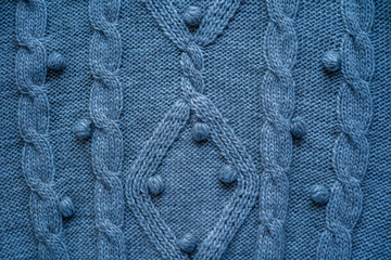 Backdrop made of light blue woolen sweater textile