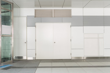 sidewalk by street wall & door