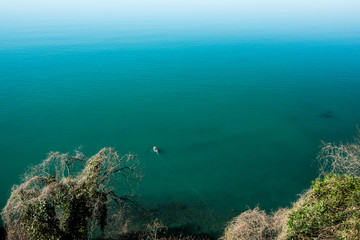 Naklejka na ściany i meble Top view of the Black Sea. Blue water in the bay. Day Georgia.