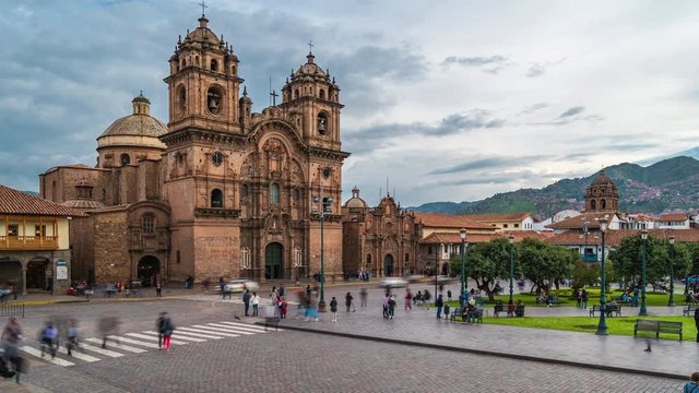 Zoom out time lapse view of tourists and locals around Plaza de Armas in Cusco, Peru, the historic capital of the Inca empire.