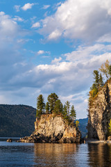 Fototapeta na wymiar The rocky shore of a mountain lake. Russia, Altai Republic, Turochaksky district, Lake Teletskoye