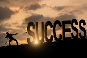 a businessman pulling success big font, success key concept