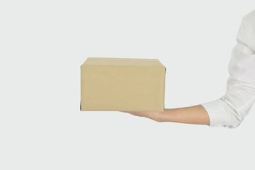 Female hands holding box isolated on grey background.