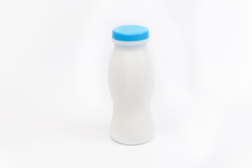 Plastic bottle with blue lid insulated against white background