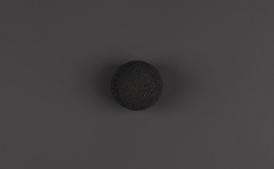 black clown nose isolated on black background