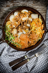 Stewed pork chop in a bright mushroom sauce.