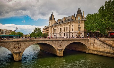 Obraz premium Bridge Pont Saint-Michel across Seine River and beautiful historic buildings of Paris