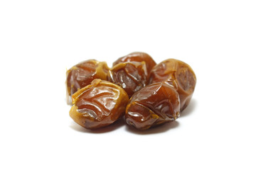 Five pieces of sukkari dates (kurma sukari) isolated on white background, perfect for breakfasting during ramadan