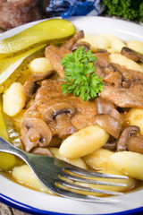 Braised pork loin with mushrooms.