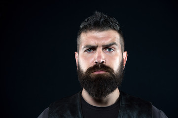 Because its your beard. Serious hipster with long beard dark background. Bearded man with stylish mustache and beard shape. Mens grooming salon. Beard barber. Fashion barbershop