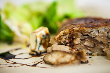 Fototapeta na wymiar Vegetarian Homemade Rosti Potato with Shitake Mushroom, Gorgonzola Cheese and Green Salad