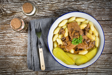 Braised pork loin with mushrooms.