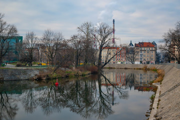 Industrial landscape in the city of Wroclaw with buildings and a chimney of an industry