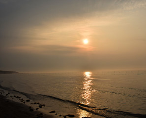 Nice sunrise in the ocean ,while seeing it from the beach,a very calm situation