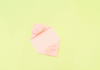 Origami pink heart on a green background, step by step instructions. as great idea for a hand made diy Valentine s Day, Mothers day gift. Step 13