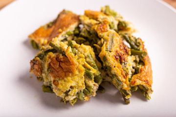 Slices of omelette with asparagus. Nutritious and quick lunch, based on proteins, good fats and vitamins.