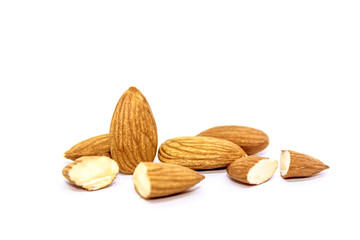 A close up of almond seeds on white isolated background. food and kitchen concept.