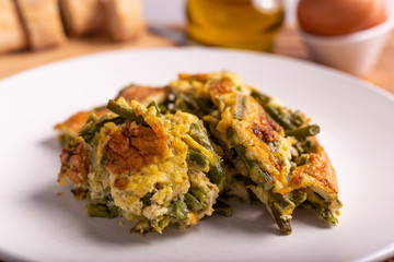 Slices of omelette with asparagus. Nutritious and quick lunch, based on proteins, good fats and vitamins.