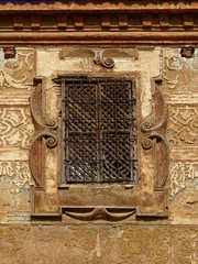 Windows and old plaster decoration of baroque façade. Concepcionistas Monastery in the old city center of Guadix. Spain. 