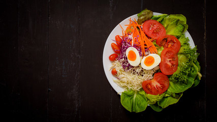 Vegetables Salad on black  wooden  background