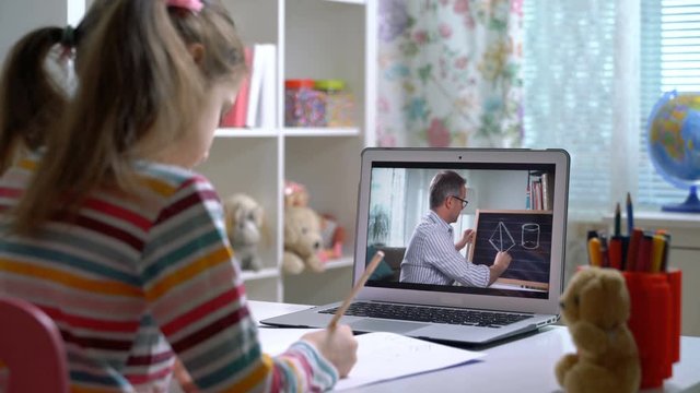 Middle-aged man distance teacher online tutor conferencing on laptop communicate with pupil by webcam video call e-learning. Home quarantine distance learning and working at home.