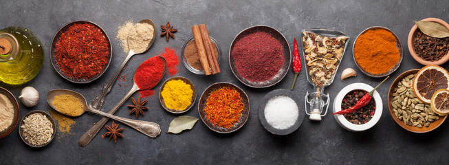 Various spices in bowls and spoons