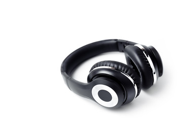 Black stylish professional wireless headphone on white background. High-quality music studio headset.