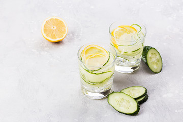 Nutritious detox water with lemon and cucumber in a pure glass. Healthy life concept.