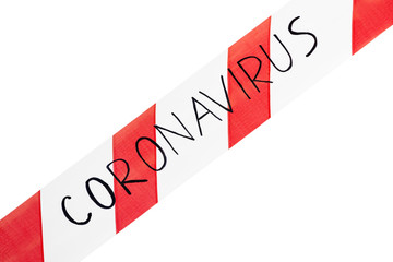 Red and white warning tape with information coronavirus on an isolated white background stretched across. Concept for protecting people from coronavirus infection. Coronavirus, Covid-19