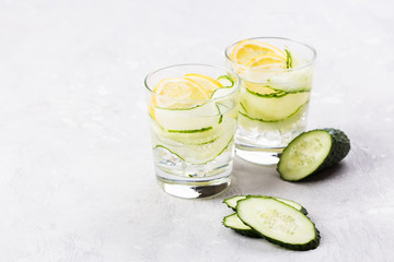 Nutritious detox water with lemon and cucumber in a pure glass. Healthy life concept.