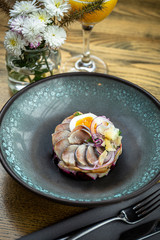 Herring tartar salad with beetroot, onions, potato