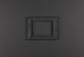 black wooden frame isolated on black background
