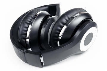 Fototapeta na wymiar Black stylish professional wireless headphone on white background. High-quality music studio headset.