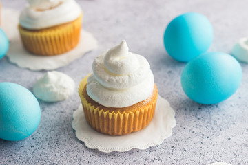 Cute easter composition. Blue easter eggs and raisin carrot muffins