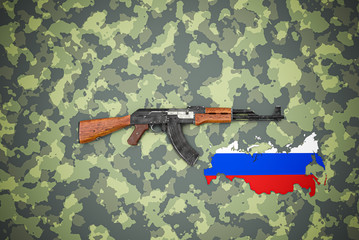 Russian automatic rifle lies on camouflage background