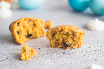 Cute easter composition. Blue easter eggs and raisin carrot muffins