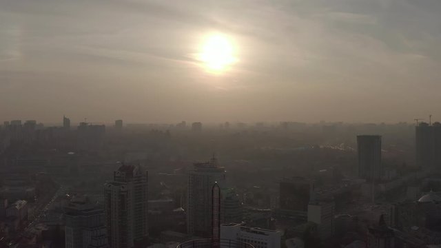 silhouette of a roof spire, lightning rod in a skyscraper. against the backdrop of sunset and evening city center