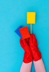 Hand protective red glove rag sponge hand wiper background blue yellow