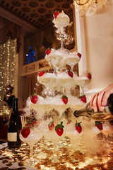 Pyramid of glasses of champagne.