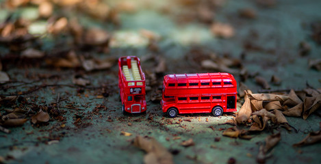toys that represent two of the main symbols of the city of London, double-decker bus on blurred...