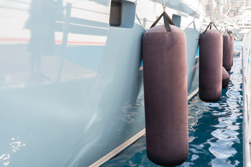 Yacht fender on yacht side moored in harbor Monaco yachr show