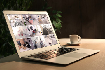 Laptop with view from CCTV cameras. Home security system